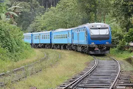 AI image tag example: a blue train on a scenic railway.
